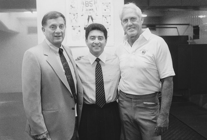 Owner Eddie DeBartolo, head coach Bill Walsh (right) and Vice President/General Manager John McVay (left) after DeBartolo's 100th win as owner, vs. Detroit Lions, 10/2/88. 49ers won 20-13. Photo by Michael Zagaris.