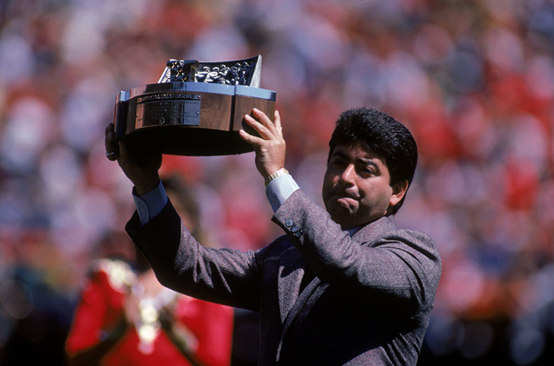SAN FRANCISCO - SEPTEMBER 15:  San Francisco 49ers owner, Eddie Debartolo, holds up the 1984 NFC Championship trophy in front of the fans prior to the game against the Atlanta Falcons at Candlestick Park on September 15, 1985 in San Francisco, California.  The 49ers won 35-16.  (Photo by George Rose/Getty Images)