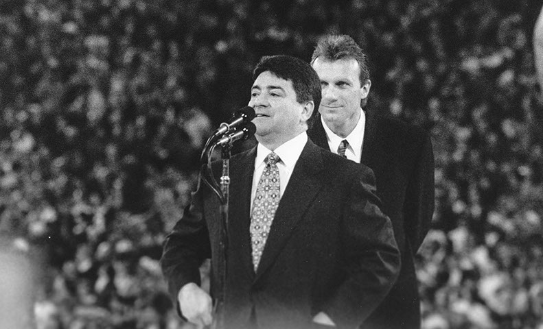 QB Joe Montana (retired at this time) and owner Eddie DeBartolo at Montana's jersey retirement celebration vs. Denver Broncos at Candlestick, 12/15/97. 49ers won 34-17. Photo by Bill Fox.
