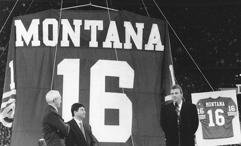 QB Joe Montana (retired at this time), 49ers owner Eddie DeBartolo and  former head coach Bill Walsh at Montana's jersey retirement celebration vs. Denver Broncos at Candlestick, 12/15/97. 49ers won 34-17. Photo by Bill Fox.